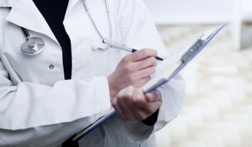 Doctor Writing on Clipboard