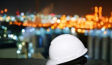 safety hard hat and lights in background