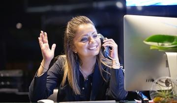 Receptionist at Desk on Phone