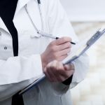 Doctor Writing on Clipboard