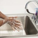 Washing Hands with Soap in Sink