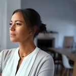 Woman Looking Out Window